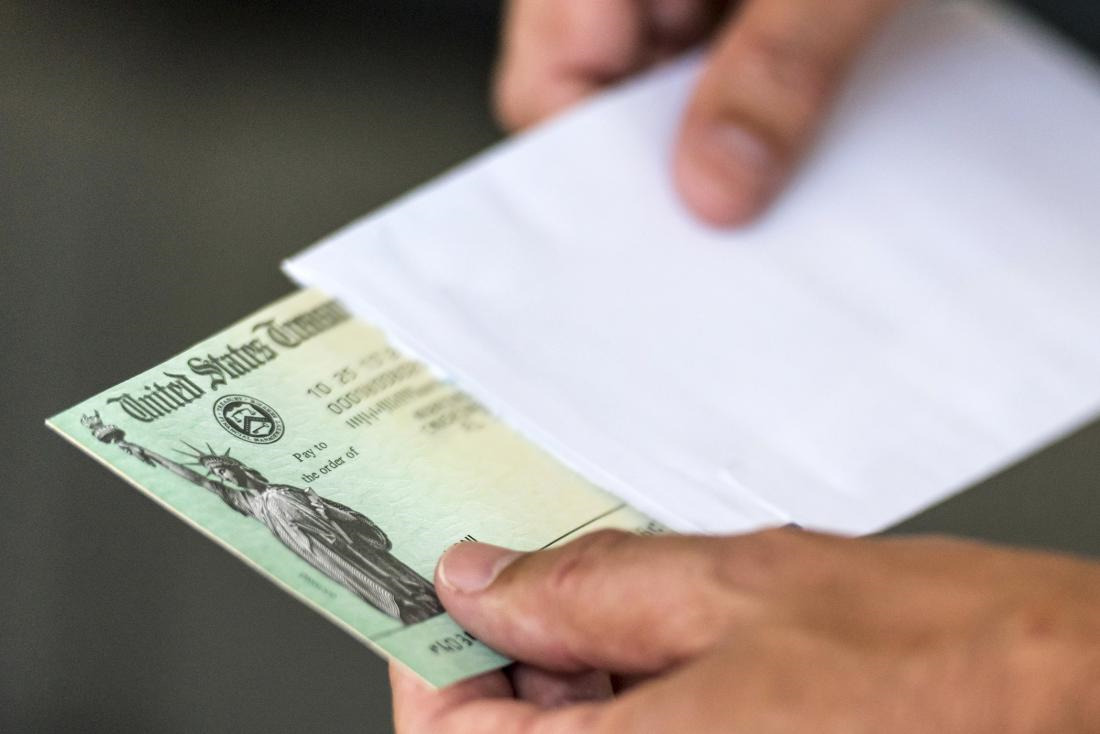 Hands reviewing retirement paperwork